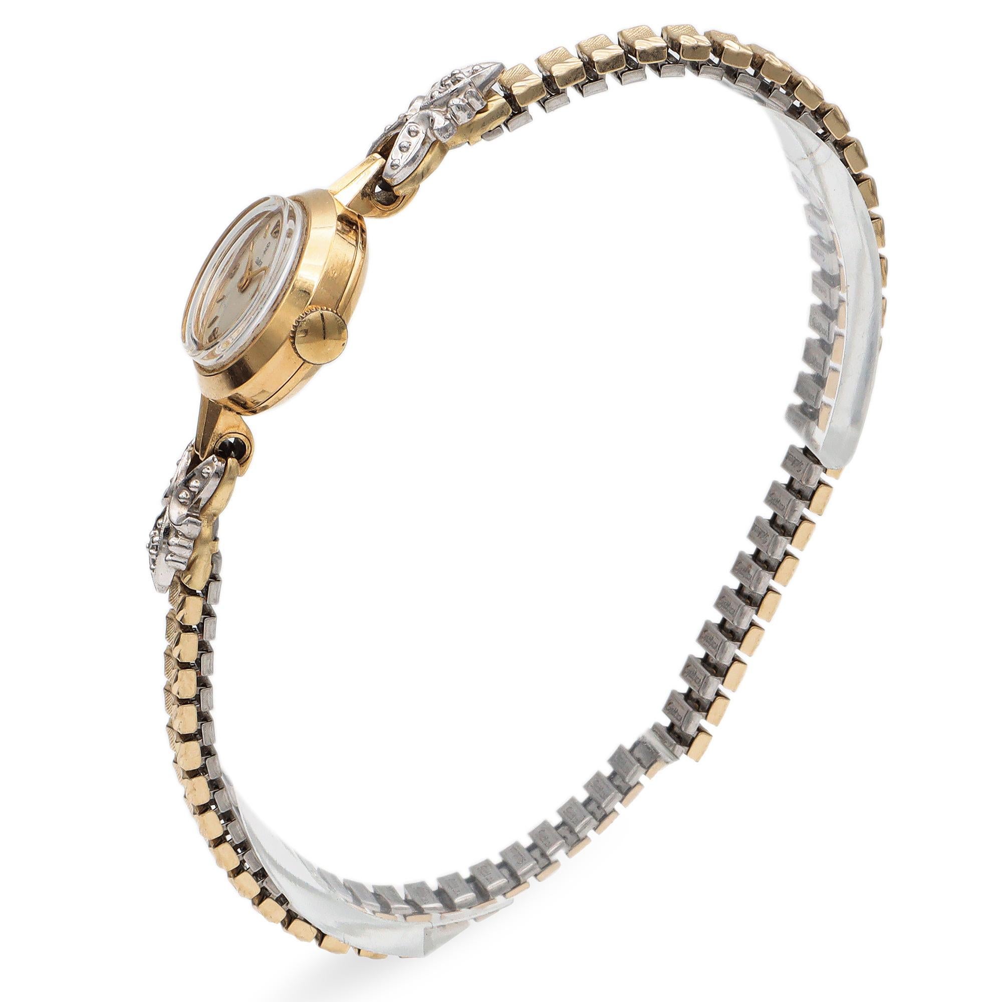 This elegant Tudor watch is crafted in 18k yellow gold. It features a delicate 17mm watch face with manual movement. The design is accentuated by white diamonds, adding a touch of brilliance. The watch showcases intricate detailing with a