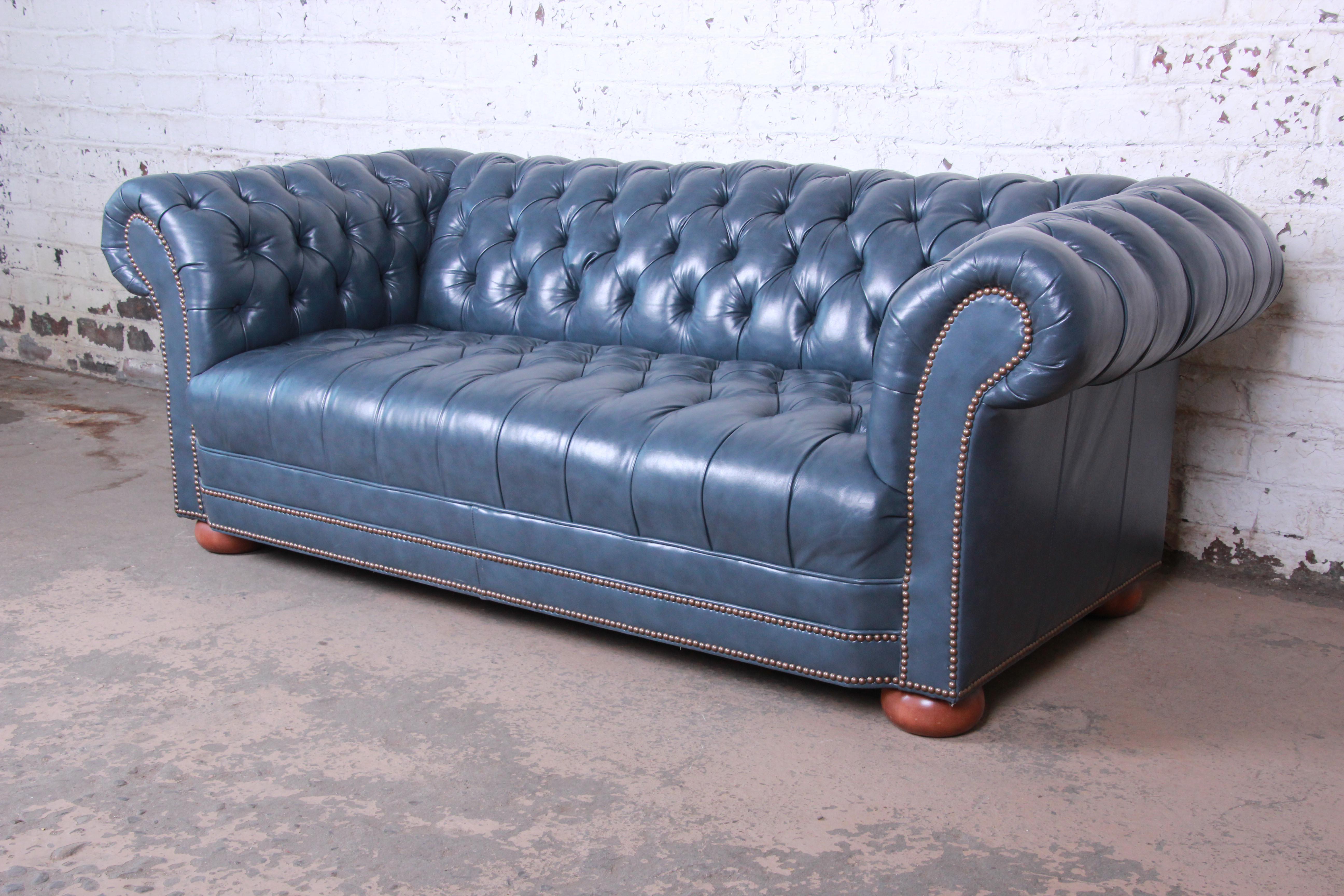 blue leather tufted sofa