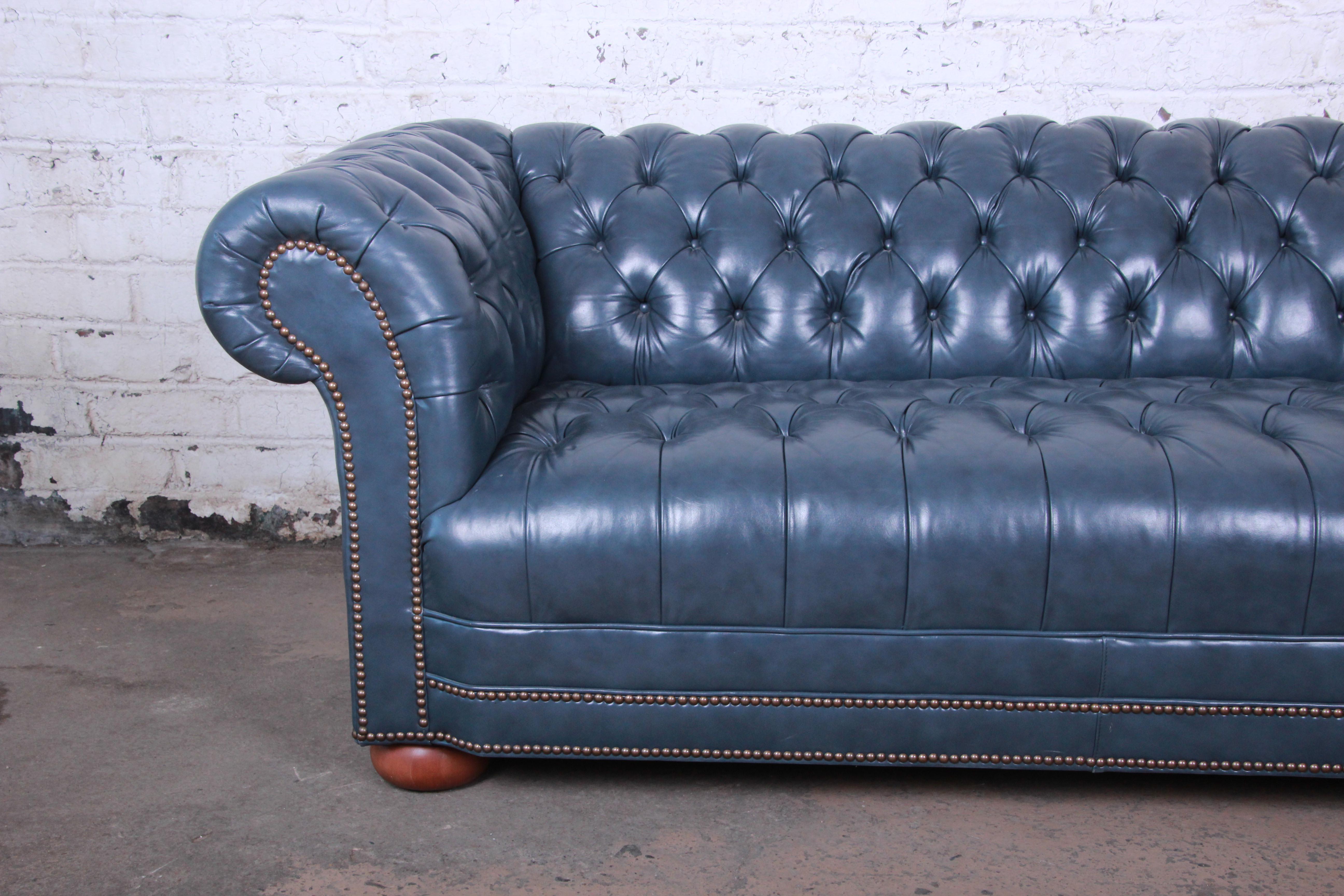 tufted blue leather sofa