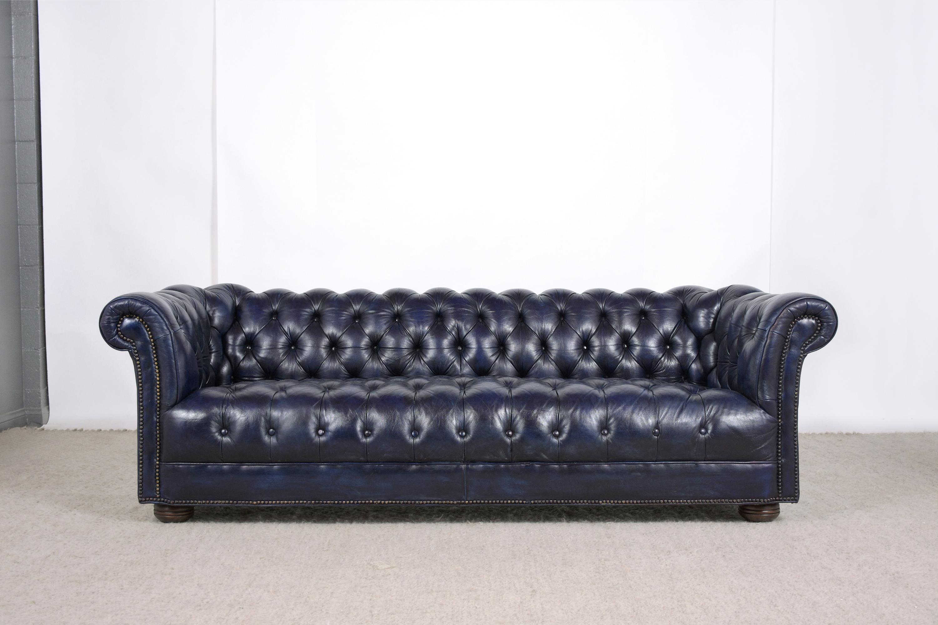 blue leather tufted sofa