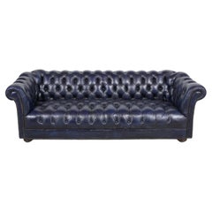 Canapé Chesterfield vintage touffeté en cuir bleu