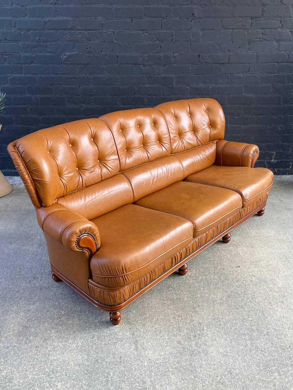 Original Vintage Condition

Dimensions: 
35”H x 79.50”W x 35”D
Seat Height 16.50”

Materials: Honey Brown Leather, Maple Wood
