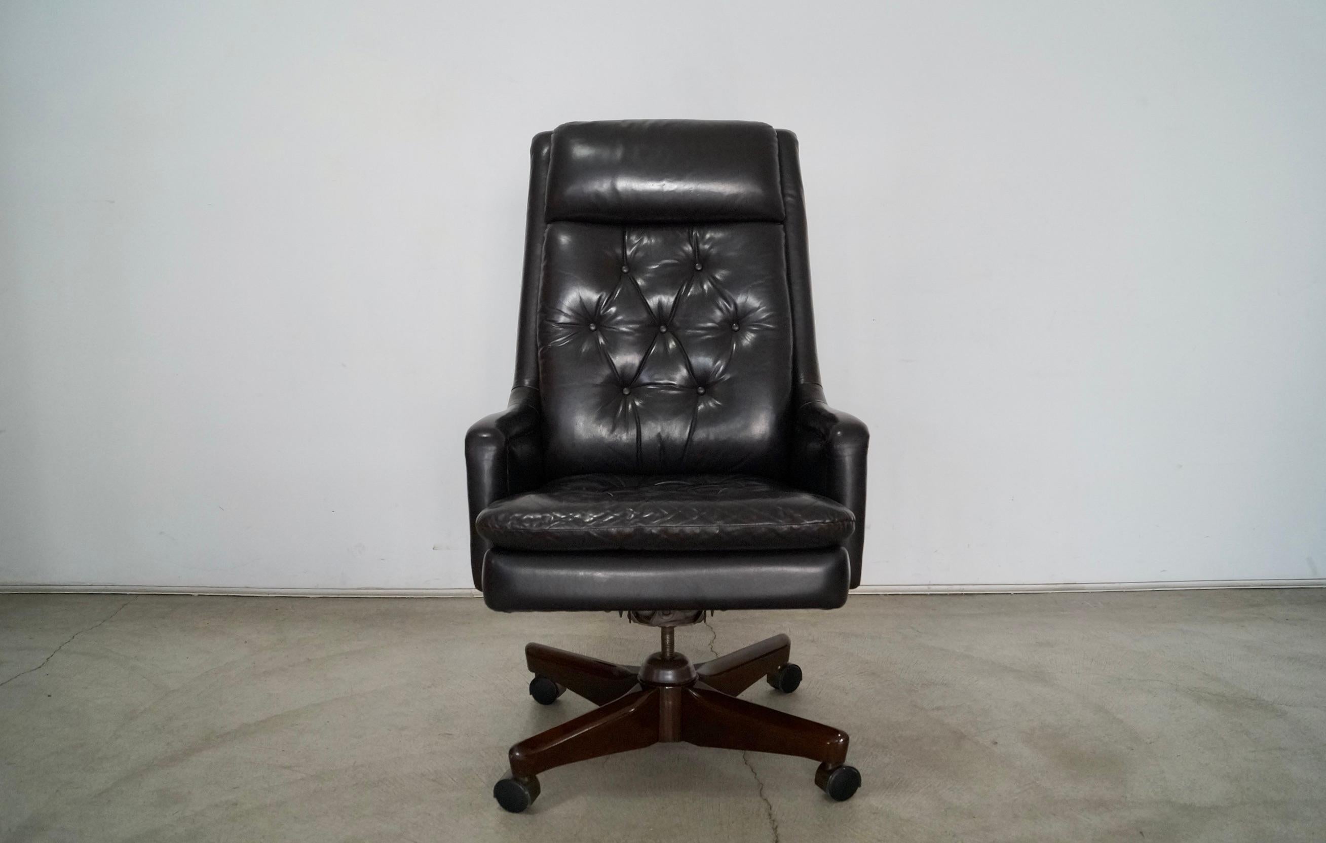 Vintage executive leather desk chair for sale. Manufactured by Monteverdi-Young in 1984, and still has the original tag. It's a really high-quality office chair with a dark brown leather, and is diamond tufted. It's really well made and solid, and