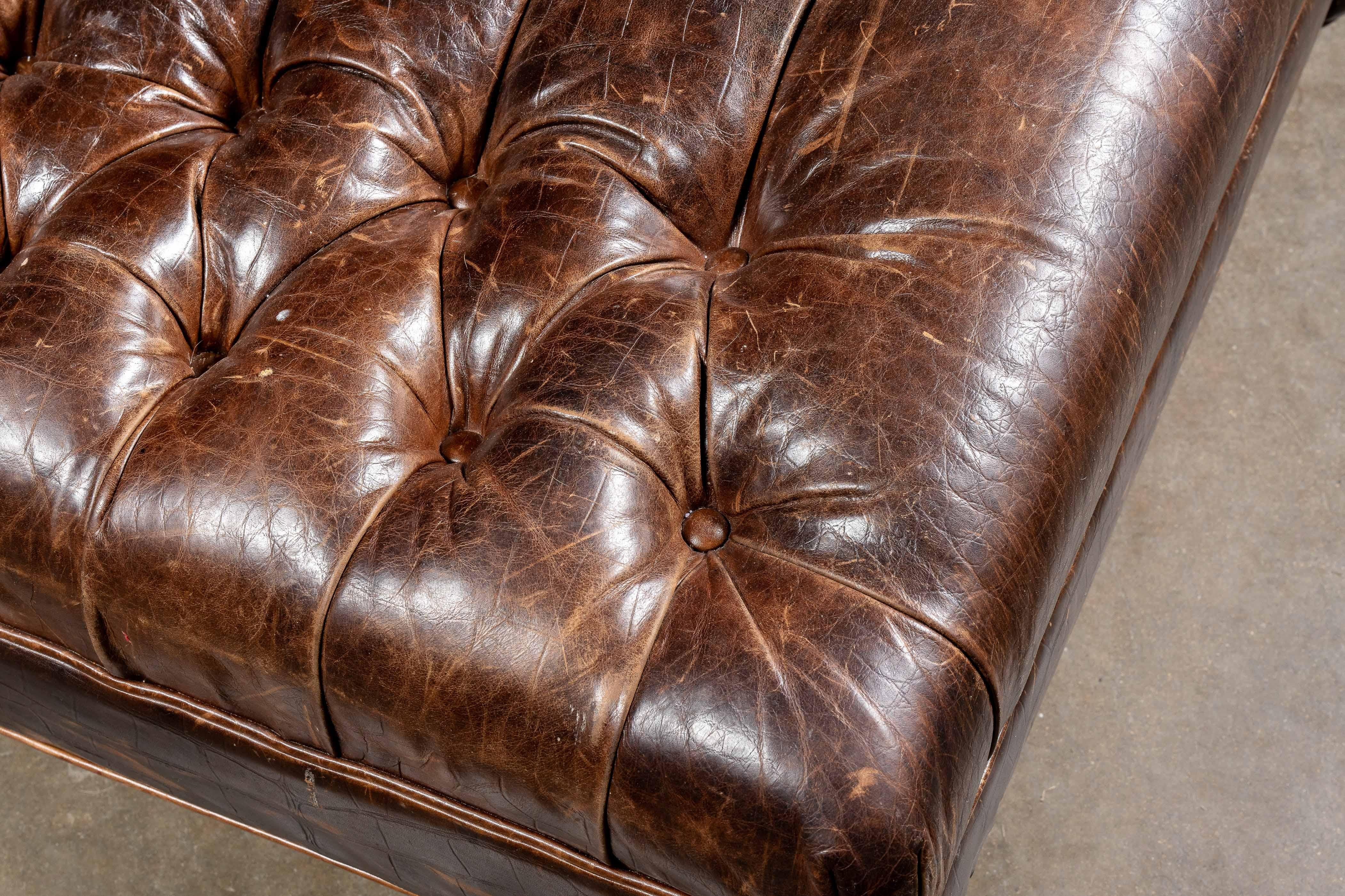 c. 1980s; Drexel Heritage Furnishings, Inc. - Morganton, NC

Vintage tufted leather Chesterfield-style ottoman.

Leather Ottoman shows signs of scuffs and wear from typical family usage, especially around the corners. The full-grain tufted leather