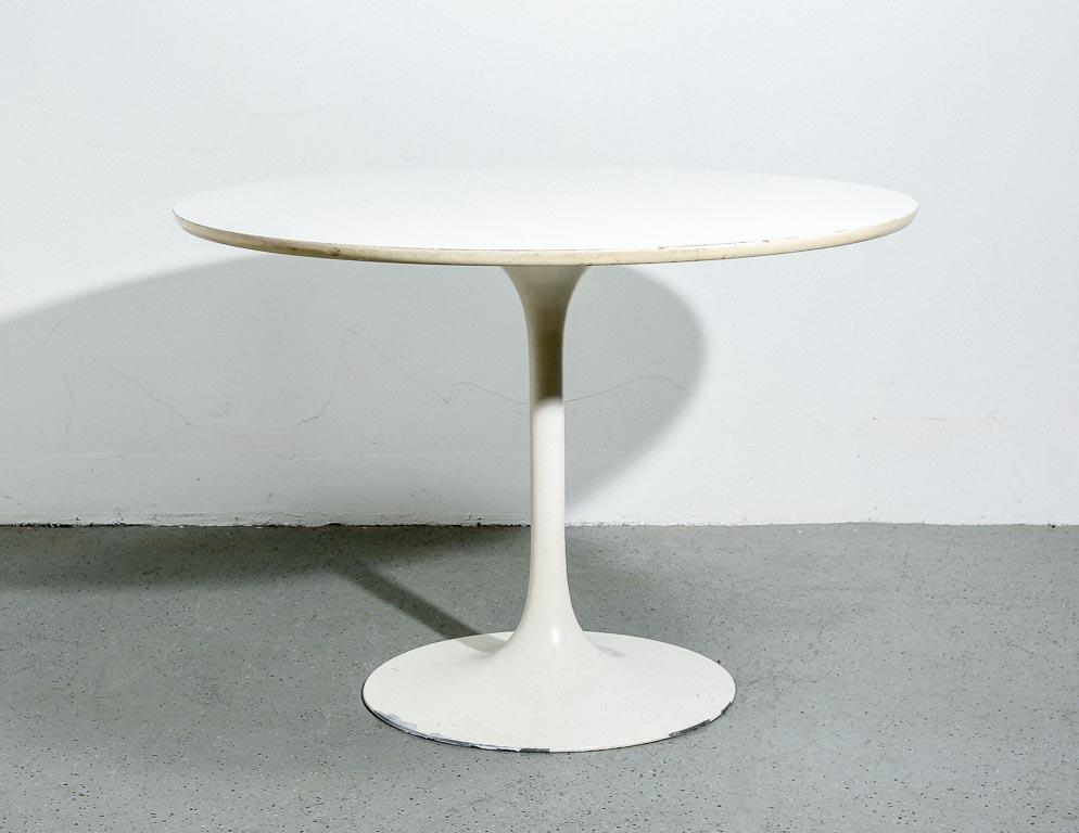 Vintage Tulip dining table by Burke, 1960s. White laminate top with white enameled pedestal base.