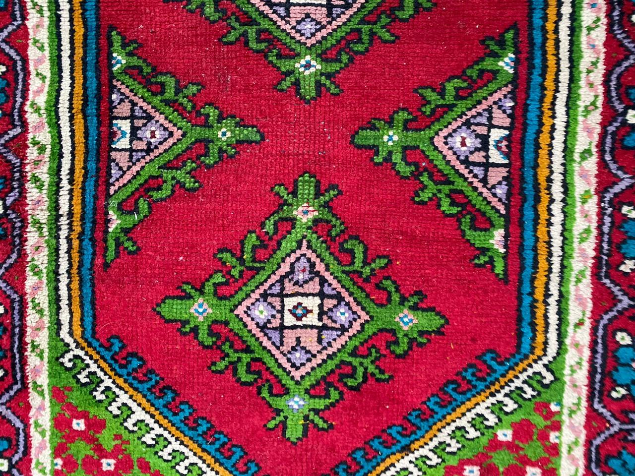 Nice Tunisian rug with beautiful geometrical design and nice colors with red, blue, yellow and green, entirely hand knotted with wool velvet on cotton foundation.