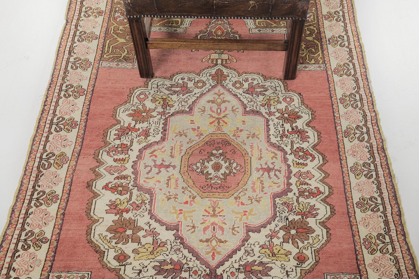 Known as the most authentic in terms of traditional style and motif, this iconic vintage of Avonas rug features tones of camel, tan, and brown color schemes. Meticulously hand-woven details where ornate flowers are accentuated with a grandiose red