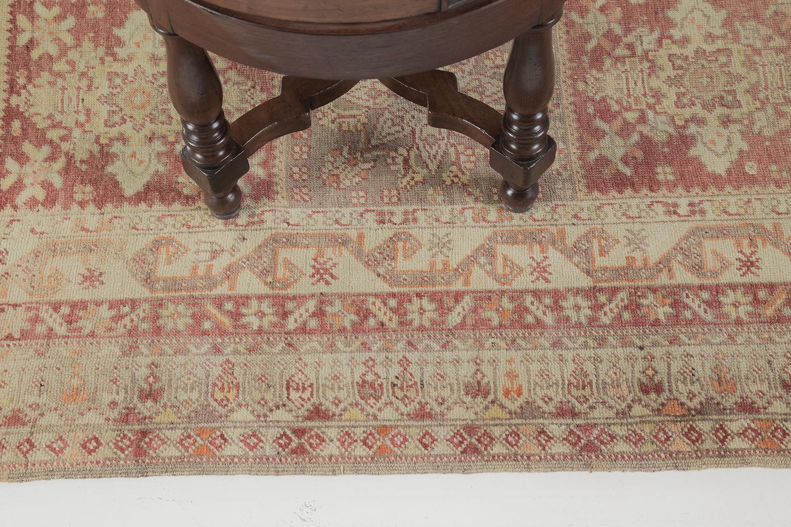 The elegant and luxurious color scheme of cream, brown, and red, bring harmony to this Vintage Turkish Anatolian rug. Brunguz embodies extensive Anatolian style with a stunning set of medallions by motif and styles in a panel on its core. It is also