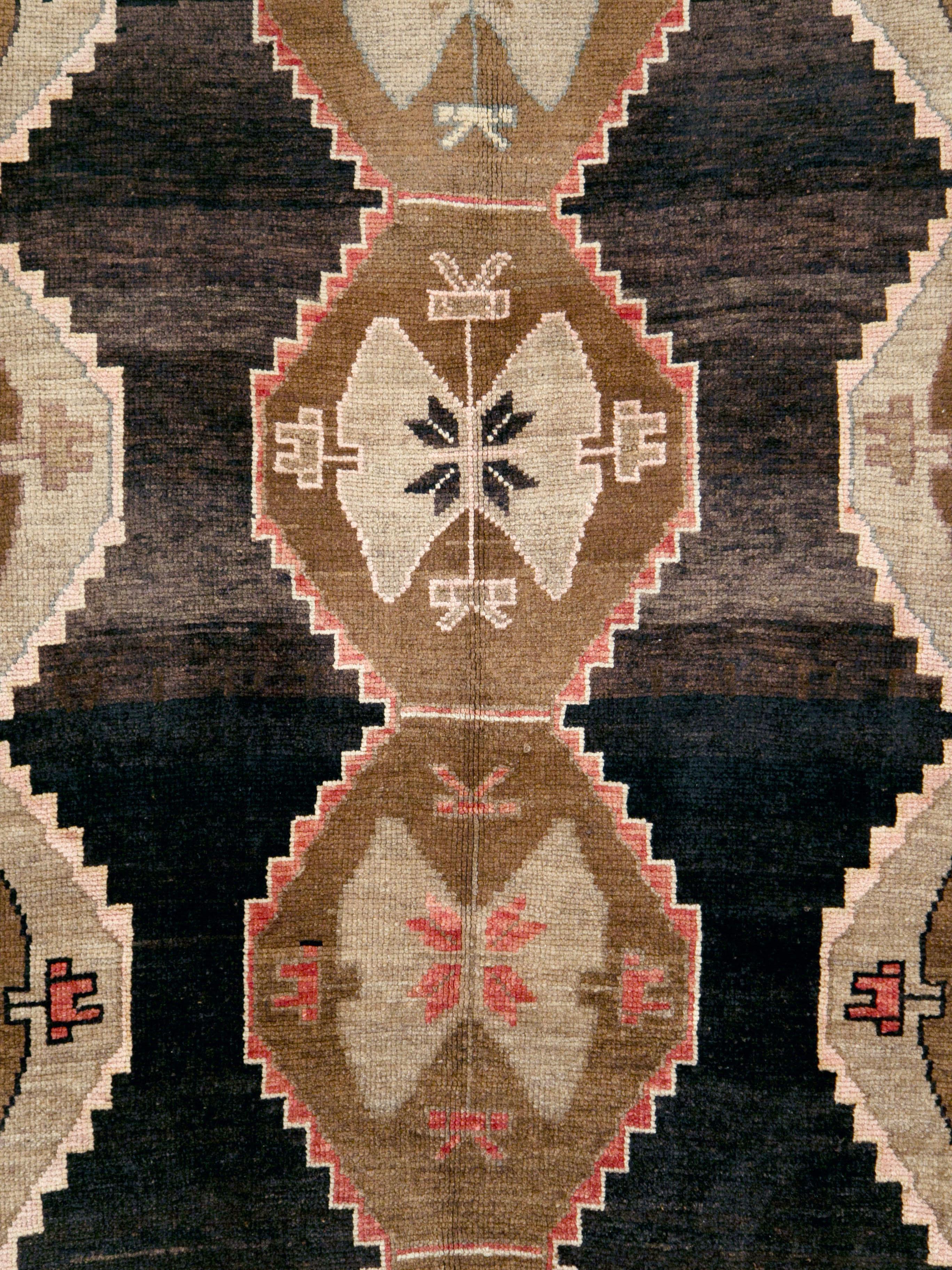 A vintage Turkish Anatolian carpet from the mid-20th century.