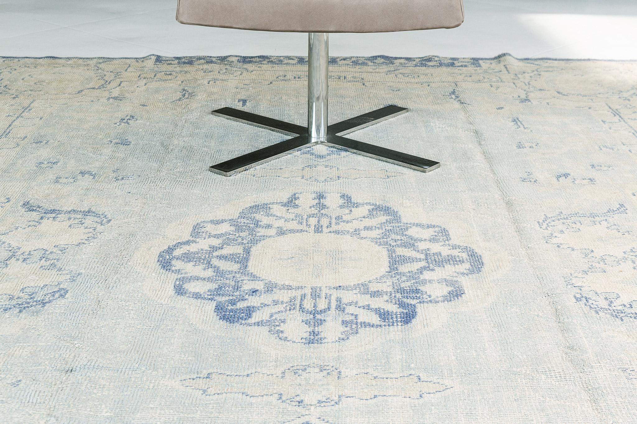 This Vintage Distressed Rug isa stylish, yet playful piece designed to look like an antique rug. It is chic for any application and durable to last a lifetime. Reflecting facets of a cool colour scheme, this distressed rug emanates timeless elegance