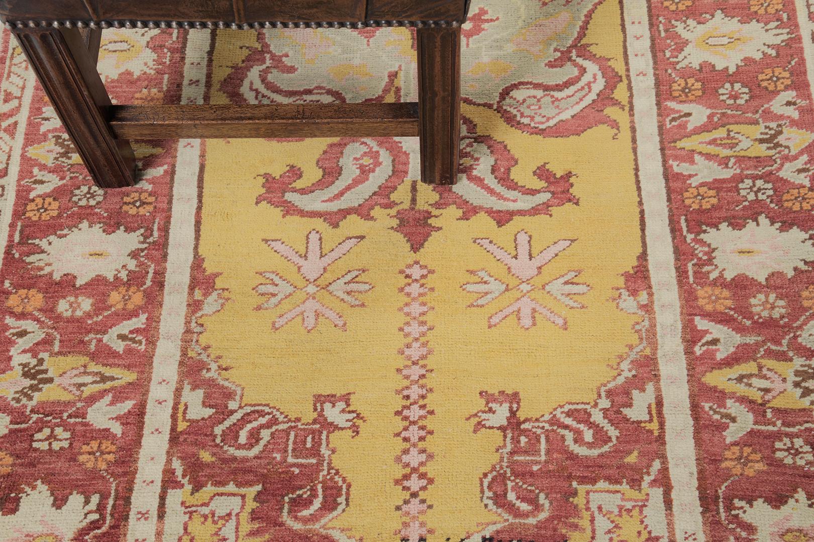 This elegant and timeless Turkish Anatolian rug made from vegetable dye has intricate and clear mirrored patterns all over the design. Guney has a blooming red color palette and golden yellow at its core perfectly matches the neutral motifs