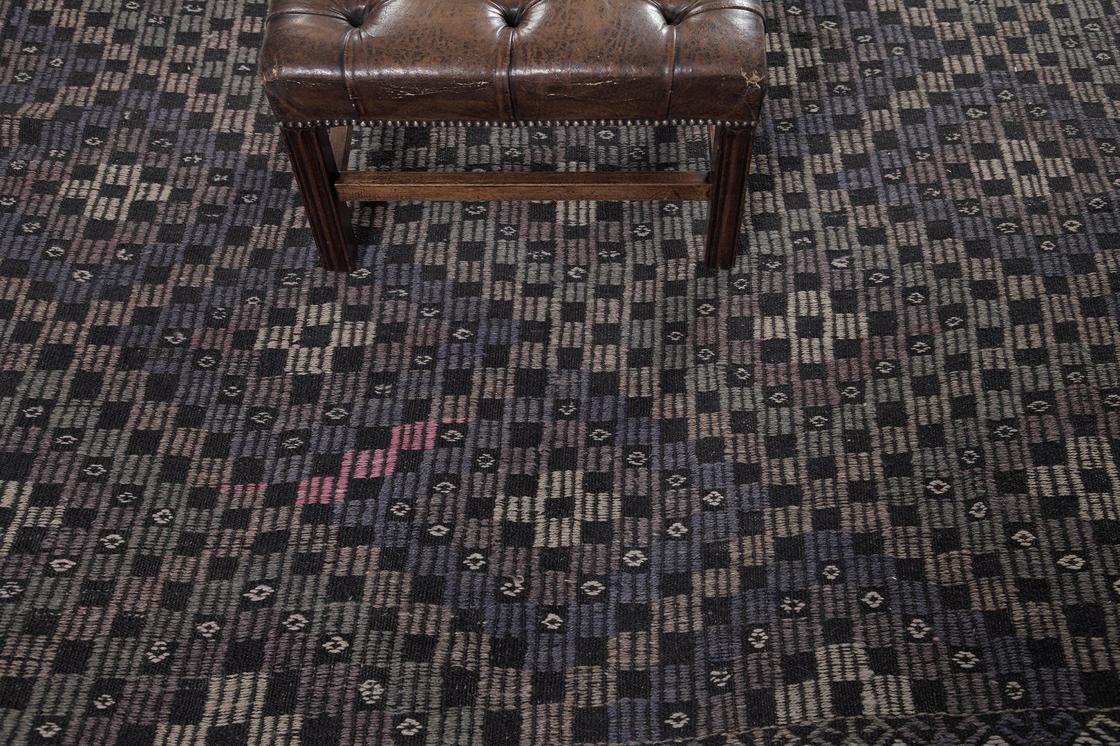 
An exquisite Vintage Turkish Anatolian Jejim Kilim that features a stack of lozenges that creates a beguiling effect to viewer’s eyes. Brilliantly composed, this compelling rug comprises linear and checkered elements forming a gorgeous cohesive