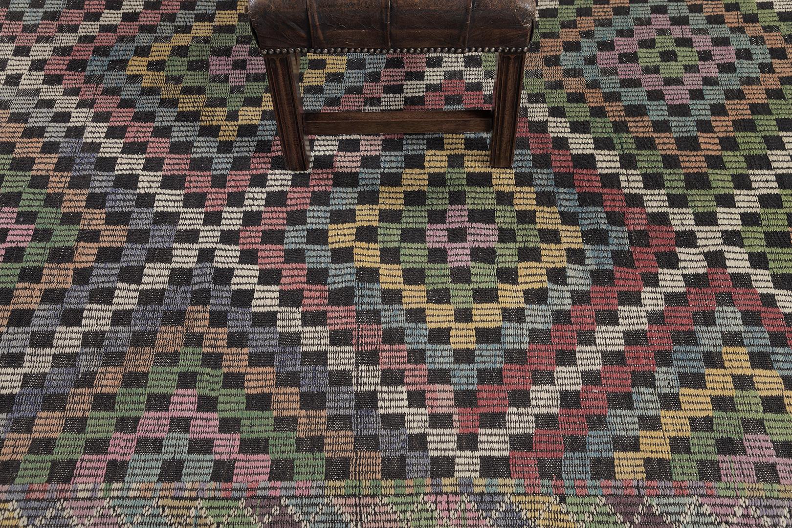 A festive vintage Turkish Anatolian Jejim Kilim rug that features a striking optical effect. Featuring a series of checkered patterns forming together in variegated vivid tones that is full of gorgeous contrast colour scheme. The organized system of