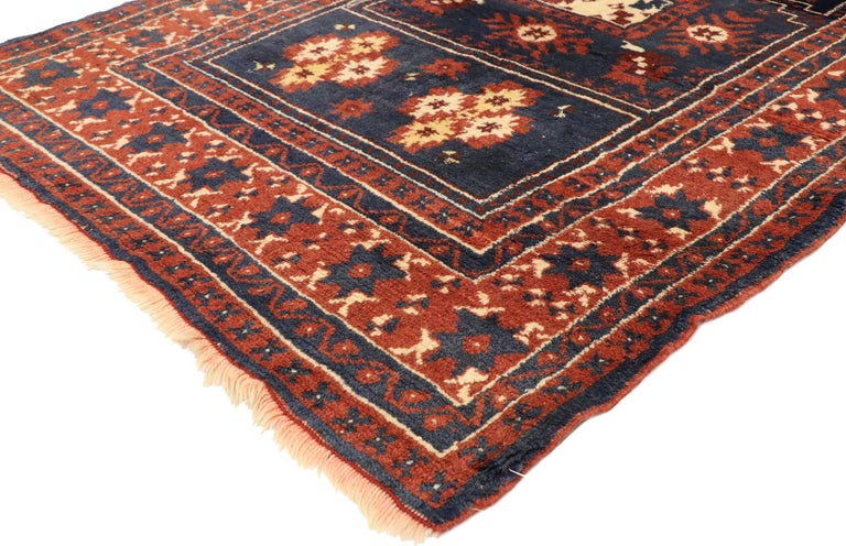74863, Vintage Turkish Oushak prayer rug. This hand-knotted wool vintage Turkish Oushak prayer rug displays timeless colors blue, soft red and cream with a light yellow accent. A stylized mihrab is filled with a square and additional symbolic