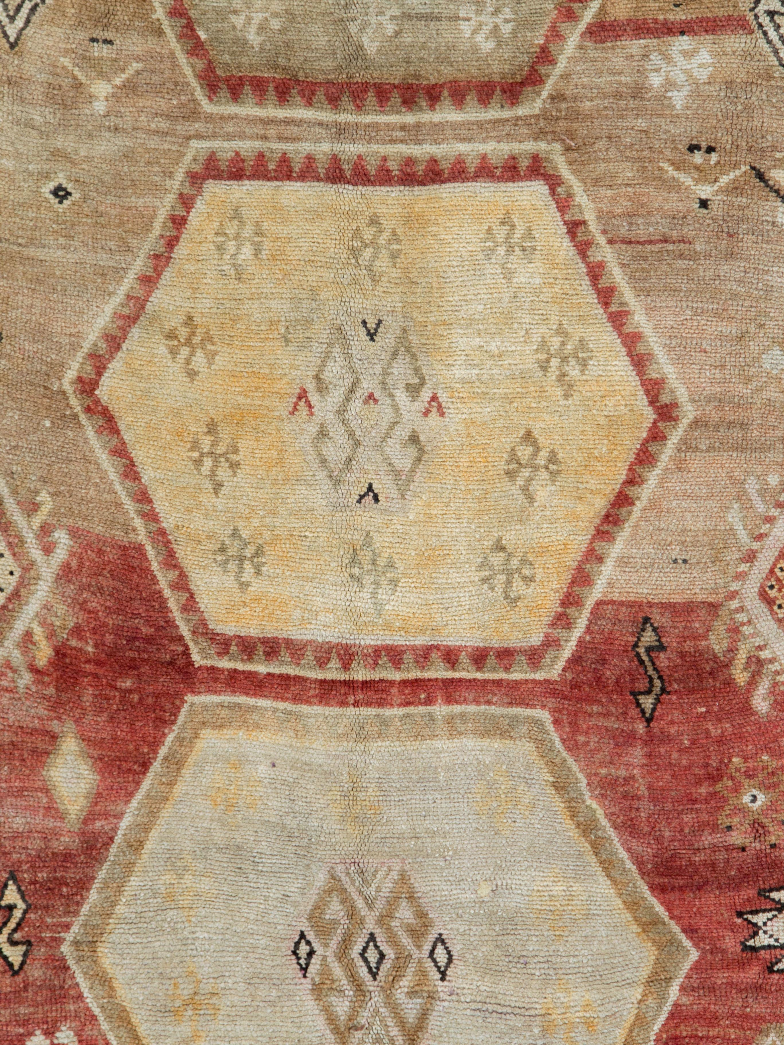 A vintage Turkish Anatolian rug from the mid-20th century in gallery format.