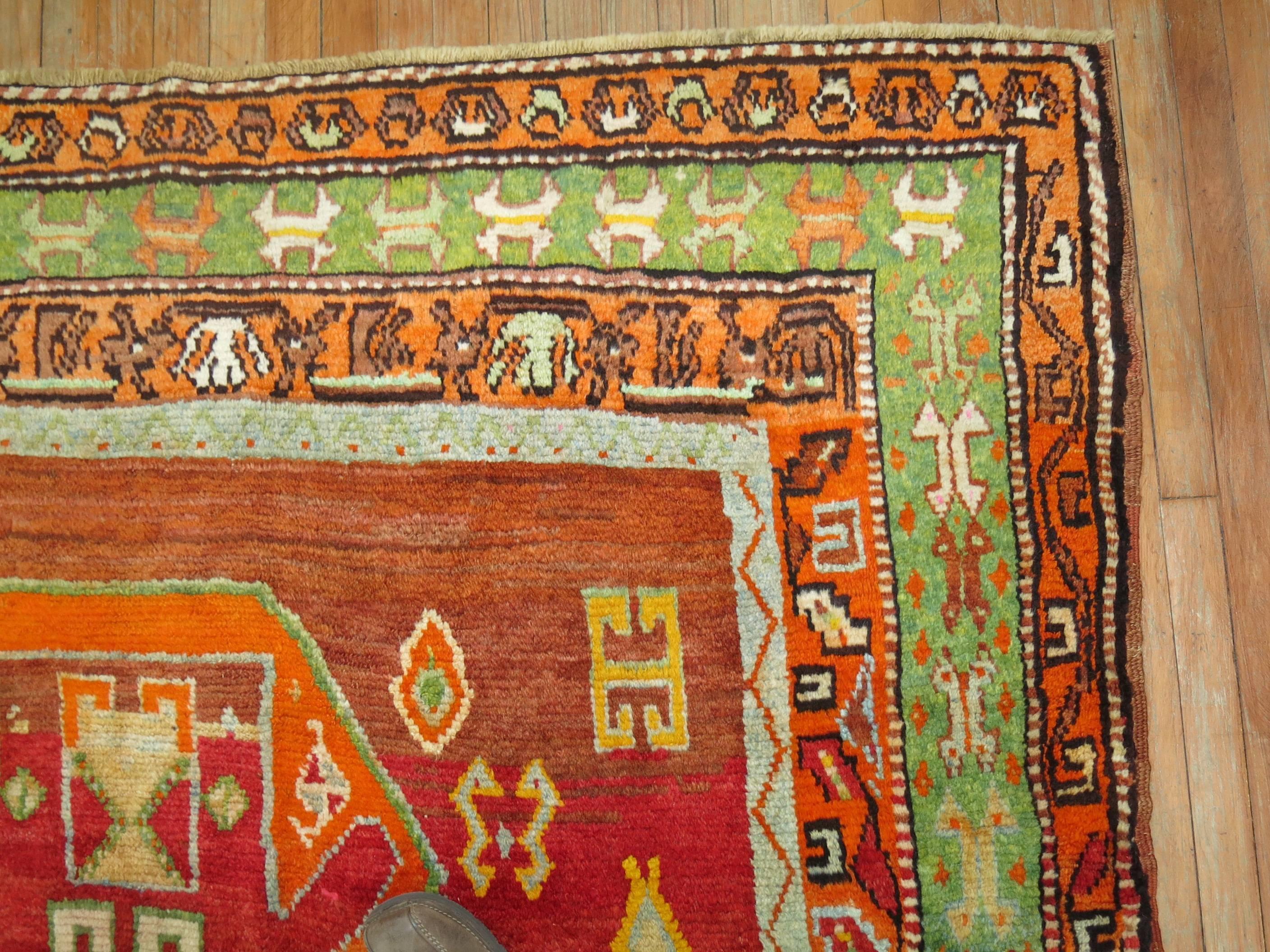 Fun and colorful eclectic Turkish Anatolian rug. Handwoven in the villages of Central Anatolia in the middle part of the 20th century.
 