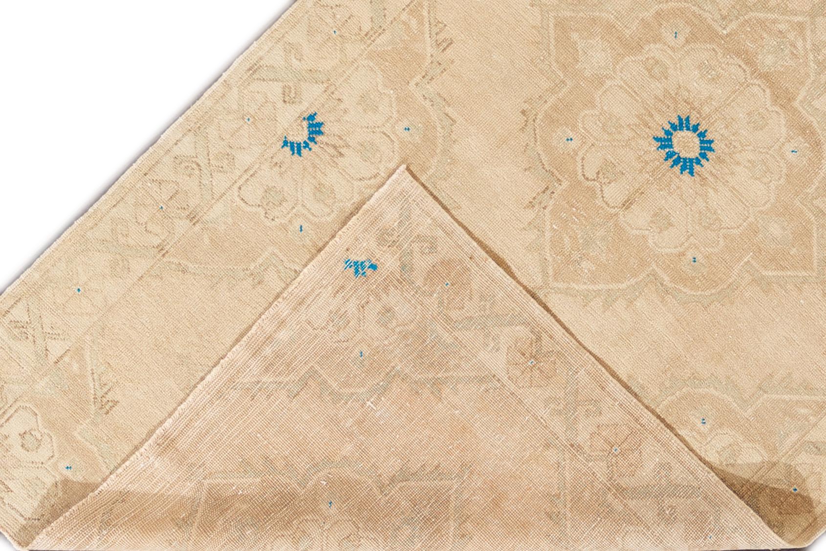A hand knotted vintage Turkish Anatolian rug with an all-over design. This rug measures 4'11