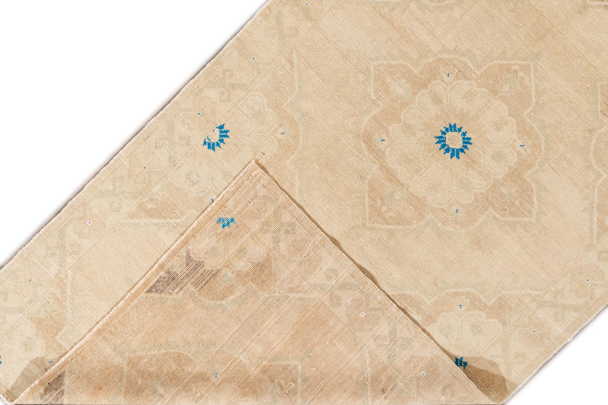 A hand knotted vintage Turkish Anatolian rug with an all-over design. This rug measures 4'9