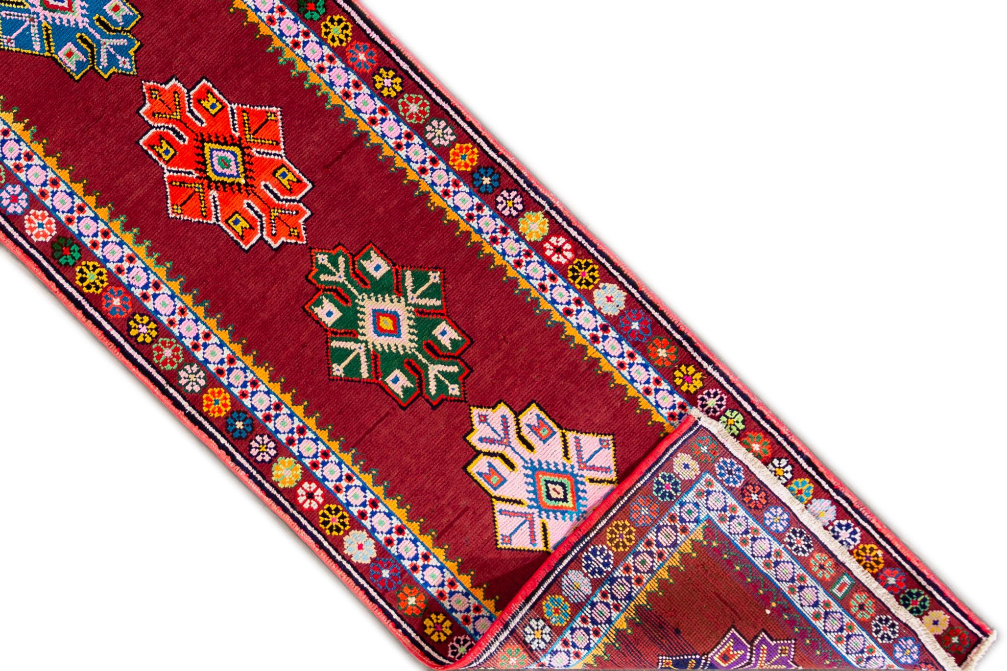 A hand knotted vintage Turkish Anatolian runner with an all-over design. This rug measures 2'9