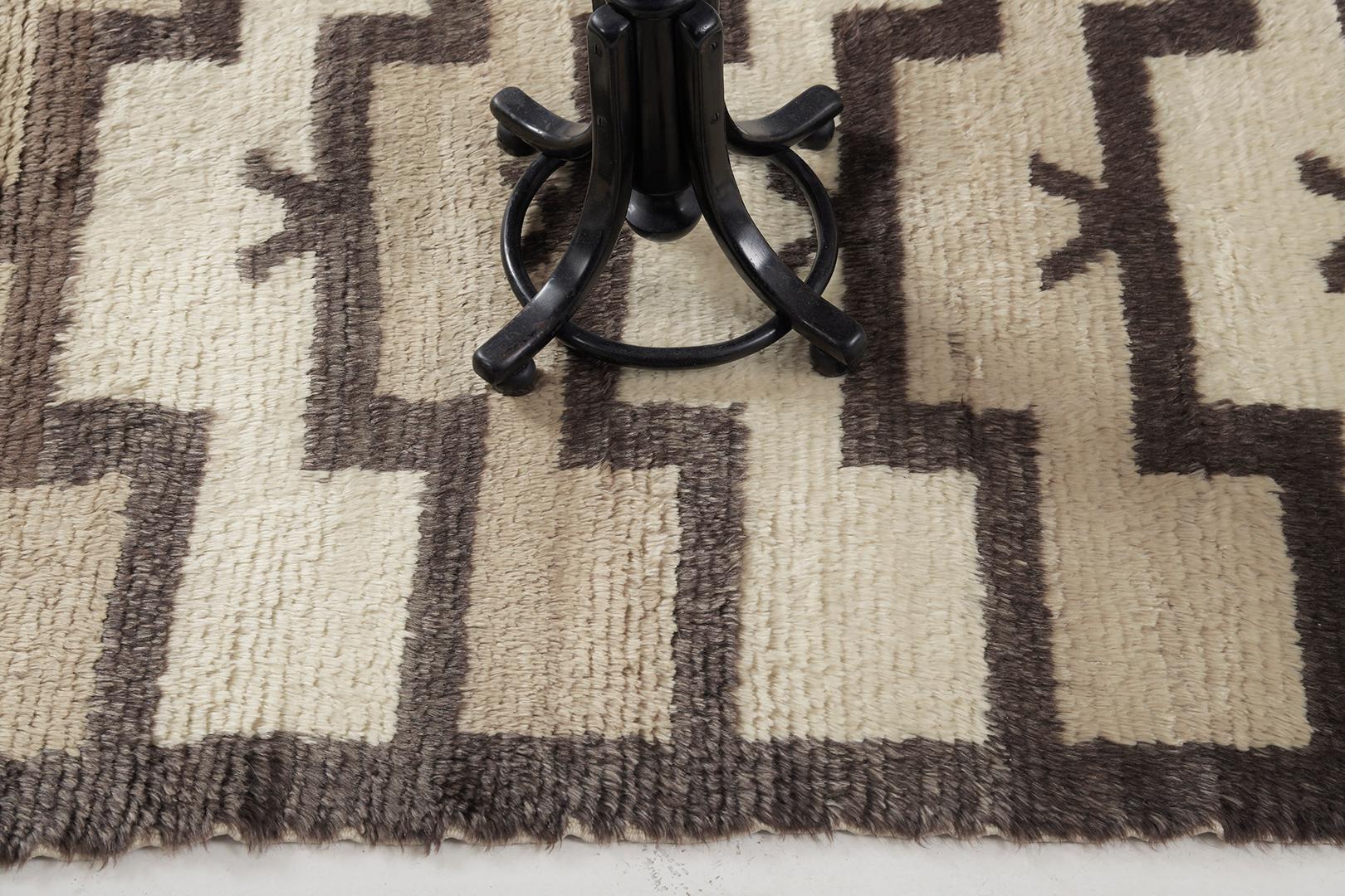 Featuring a gorgeous wool shag of this Vintage Turkish Anatolian Tulu that showcases a muted and captivating earthy tones of ivory and cedar brown. This remarkable rug displays a serrated lozenge medallion gloriously accented in the plush field.