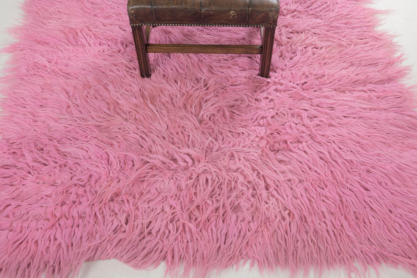 An alluring vintage Turkish Anatolian Tulu rug that will light up your room through the captivating burst of colour. The vivacious mood given by this exquisite rug features the most captivating tone of carnation pink. Its colour range is spectacular