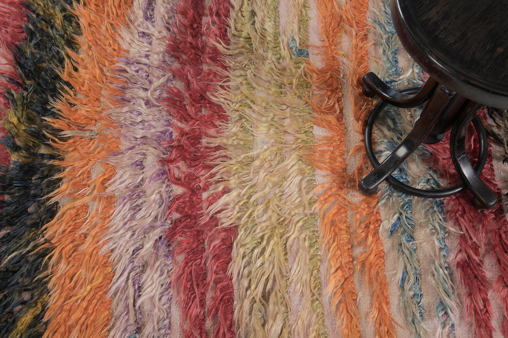 Tulu is a gorgeous wool shag that features amazing layers of variegated tones of rose, black, orange, purple, blue, and gold. It augments the stunning scenery and all will be loved by the next generation. Turkish Anatolian rugs weave together dyes