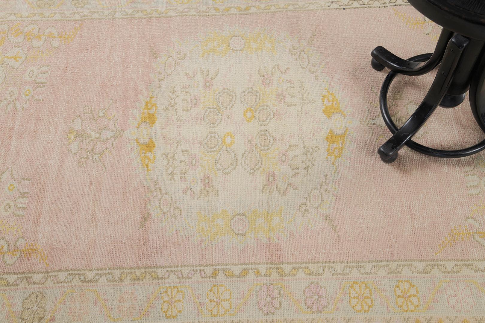 Yuntdag is a neutral and gold vintage Turkish rug that can modify your space into a luxury. A central majestic pattern is well complemented with the emanating motif borders of this masterpiece. Adding this up to your collection will surely be a
