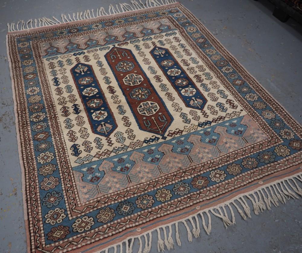 Vintage Turkish Bergama rug of traditional design with soft colours
About 40 years old

The rug has very pleasing colours including soft pink, ivory and a nice light blue The border is of a traditional rosette design on a soft blue ground The rug is