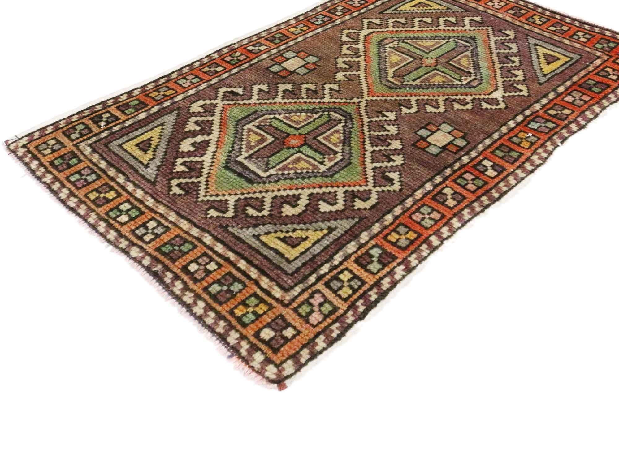 51193 Vintage Turkish Yastik Rug, 01'05 x 01'11. This hand-knotted wool vintage Turkish Yastik rug is a captivating expression of Anatolian artistry, steeped in symbolism and cultural heritage. The rug's striking purple plum-colored field sets a