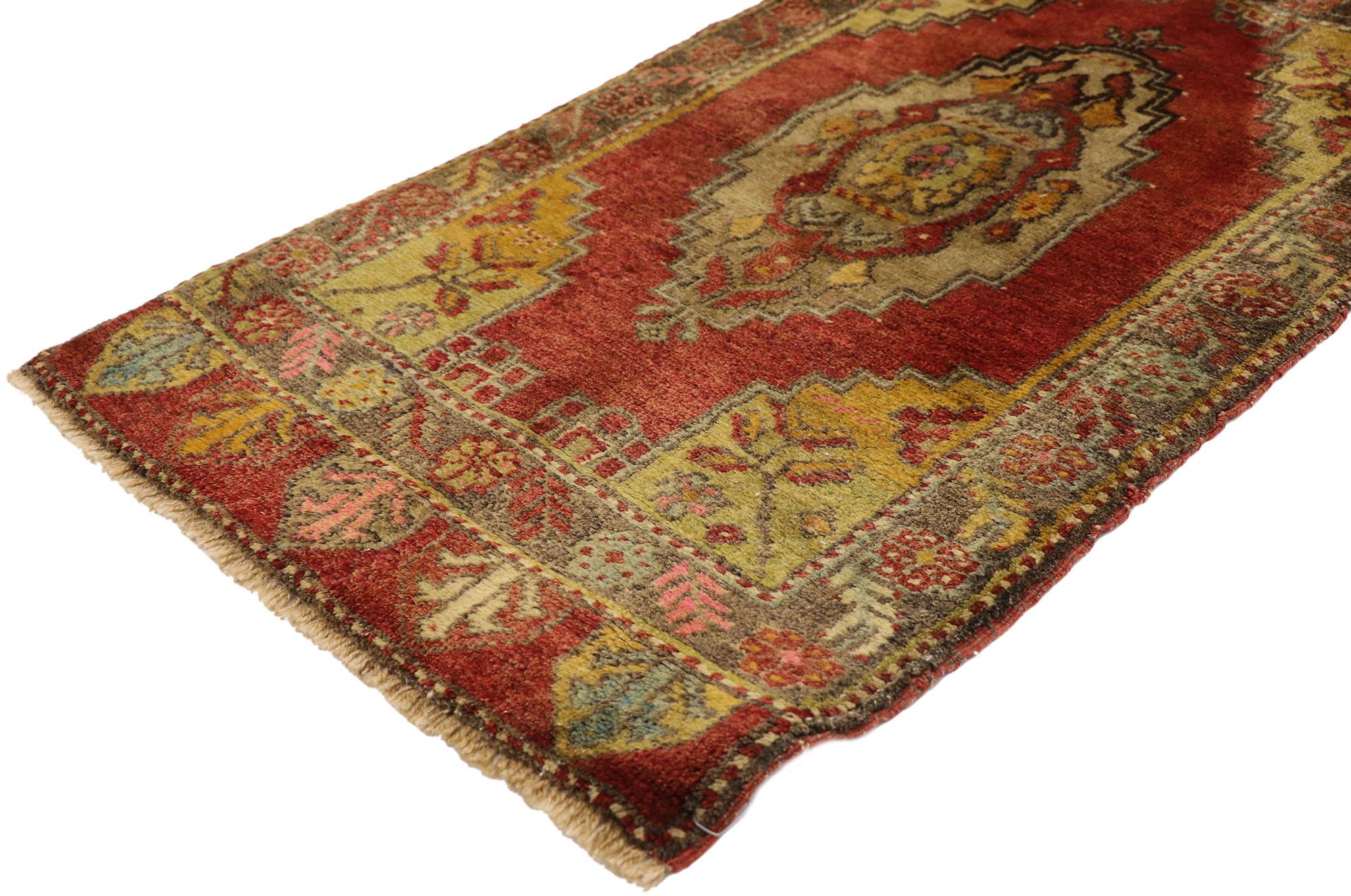 51462 Vintage Turkish Yastik Rug, 01'10 x 03'04.​ This hand-knotted wool vintage Turkish Yastik rug is a mesmerizing canvas of color and symbolism, drawing the eye into its intricate patterns. The rug's deep red field sets a warm and inviting