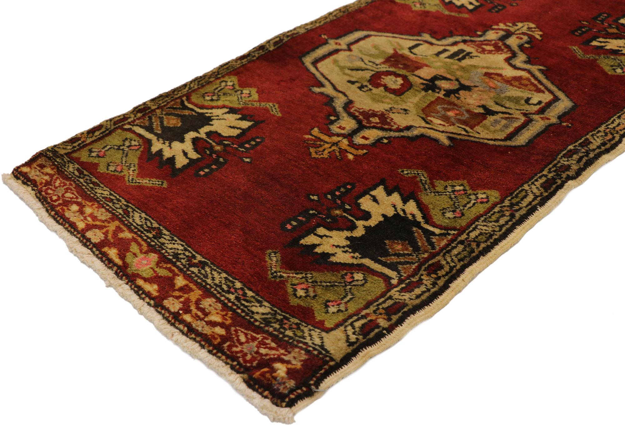 51477 Vintage Turkish Yastik Rug, 01'09 x 03'05. This hand-knotted wool vintage Turkish Yastik rug is a beautiful testament to the artistry and cultural heritage of Anatolia. The mesmerizing composition features a deep, vibrant red field, which