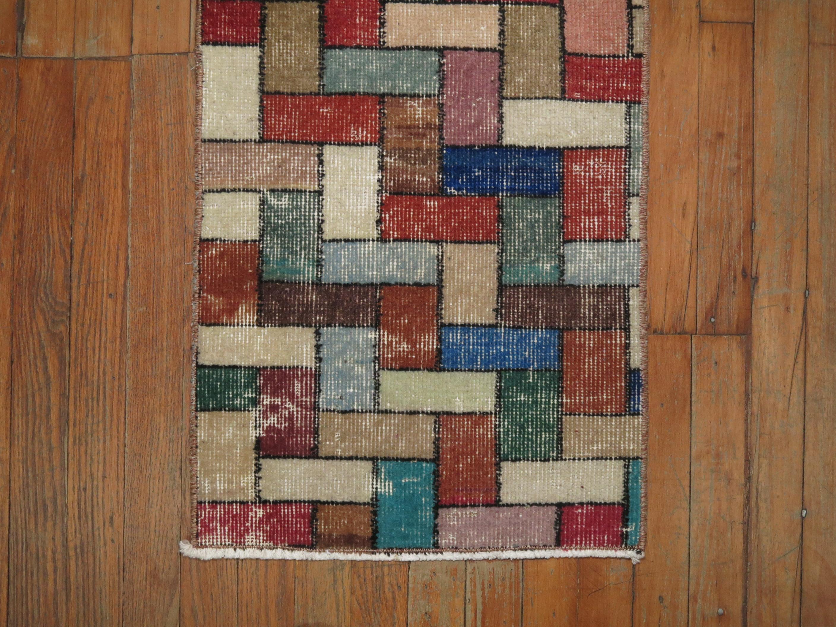 A mid-20th century bright colored Turkish rug with a deco inspired Tetris game mosaic style design. You can have some fun with this.

1'6'' x 3'3''