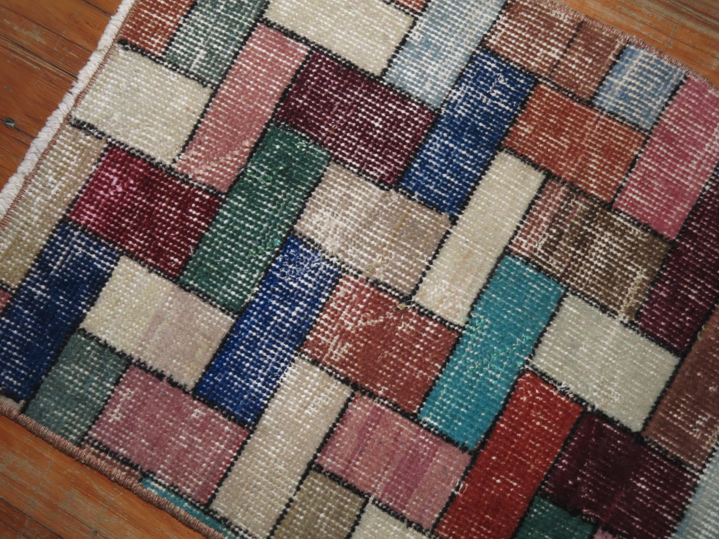 A mid-20th century bright colored Turkish rug with a deco inspired Tetris game mosaic style design. You can have some fun with this.