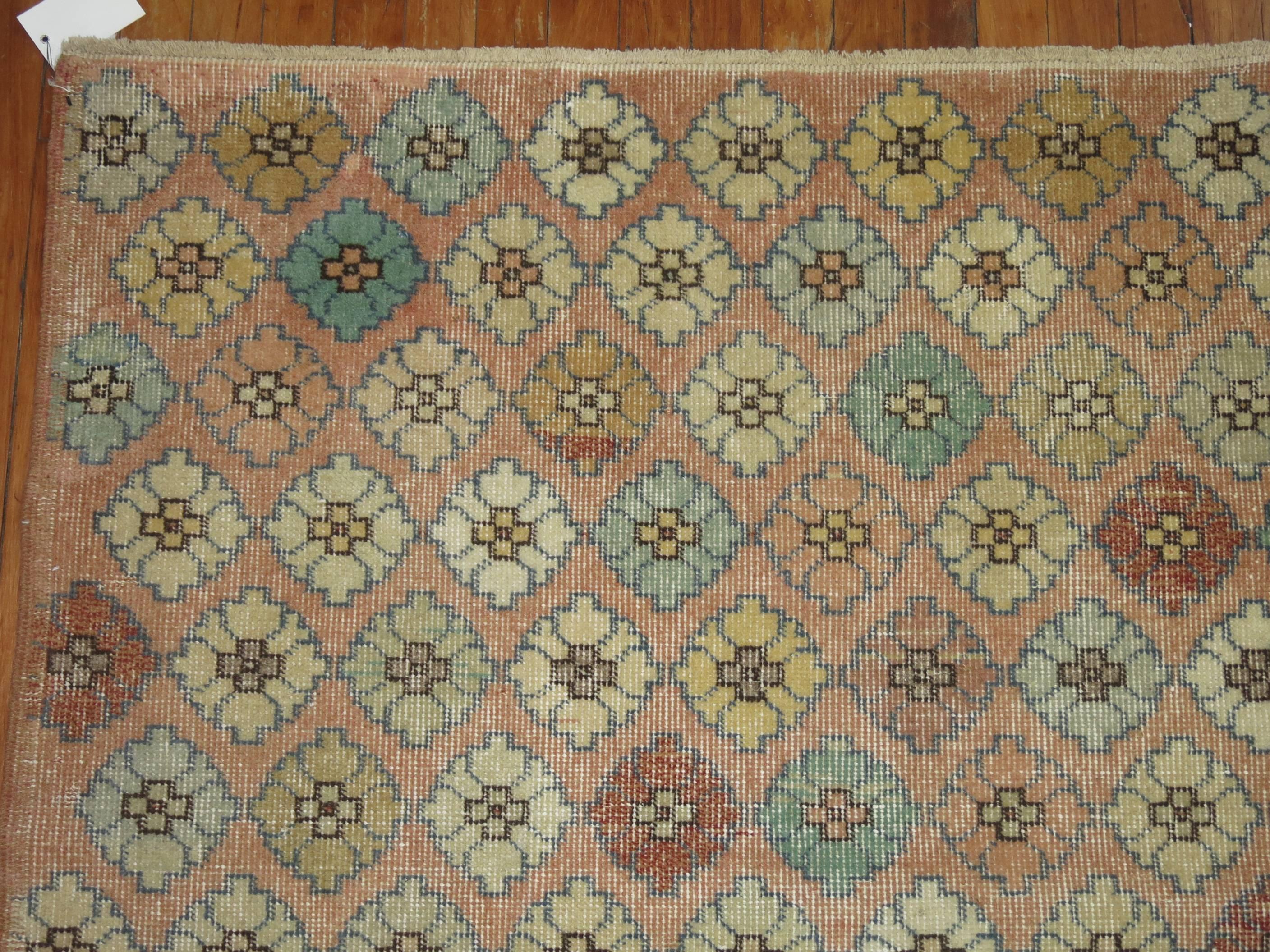 Vintage Turkish deco rug with an all-over repetitive design.