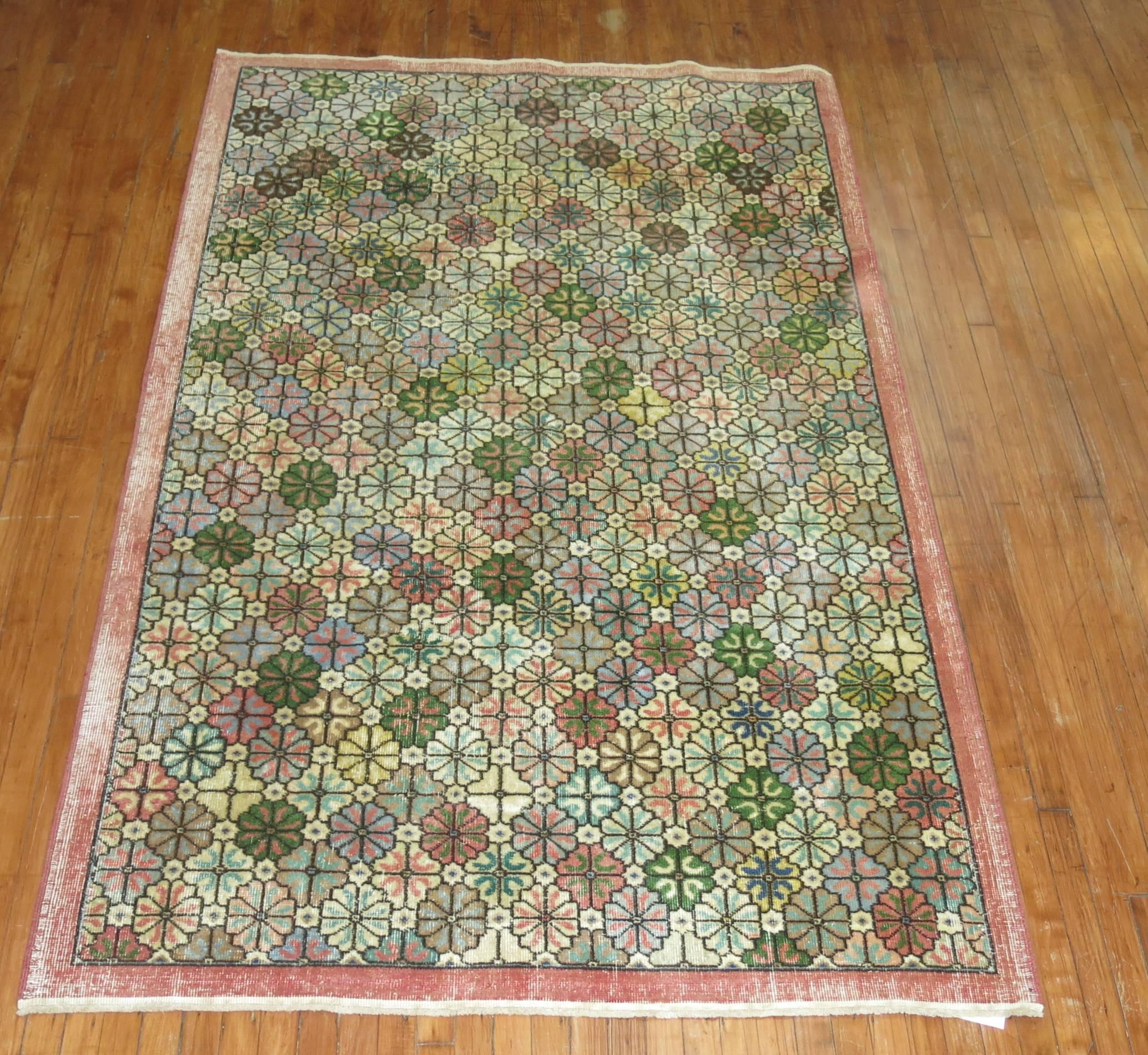Vintage Turkish Deco rug with an all-over repetitive design in feminine colors.

5'2'' x 8'6''