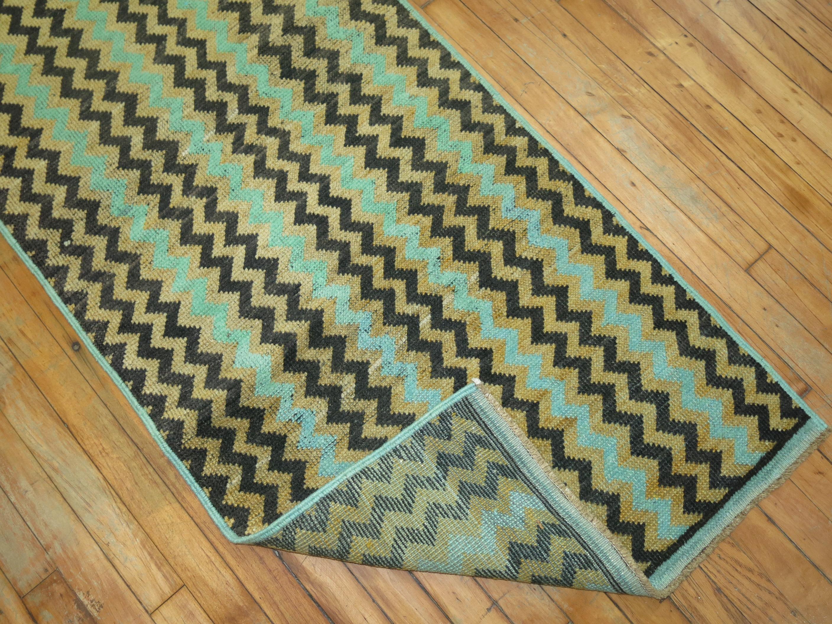 Rare long and narrow size mid-20th century Turkish deco long and narrow runner with a repetitive all-over checkerboard cintomani design in black green and yellow accents.

Measures: 2'4'' x 19'6''.
