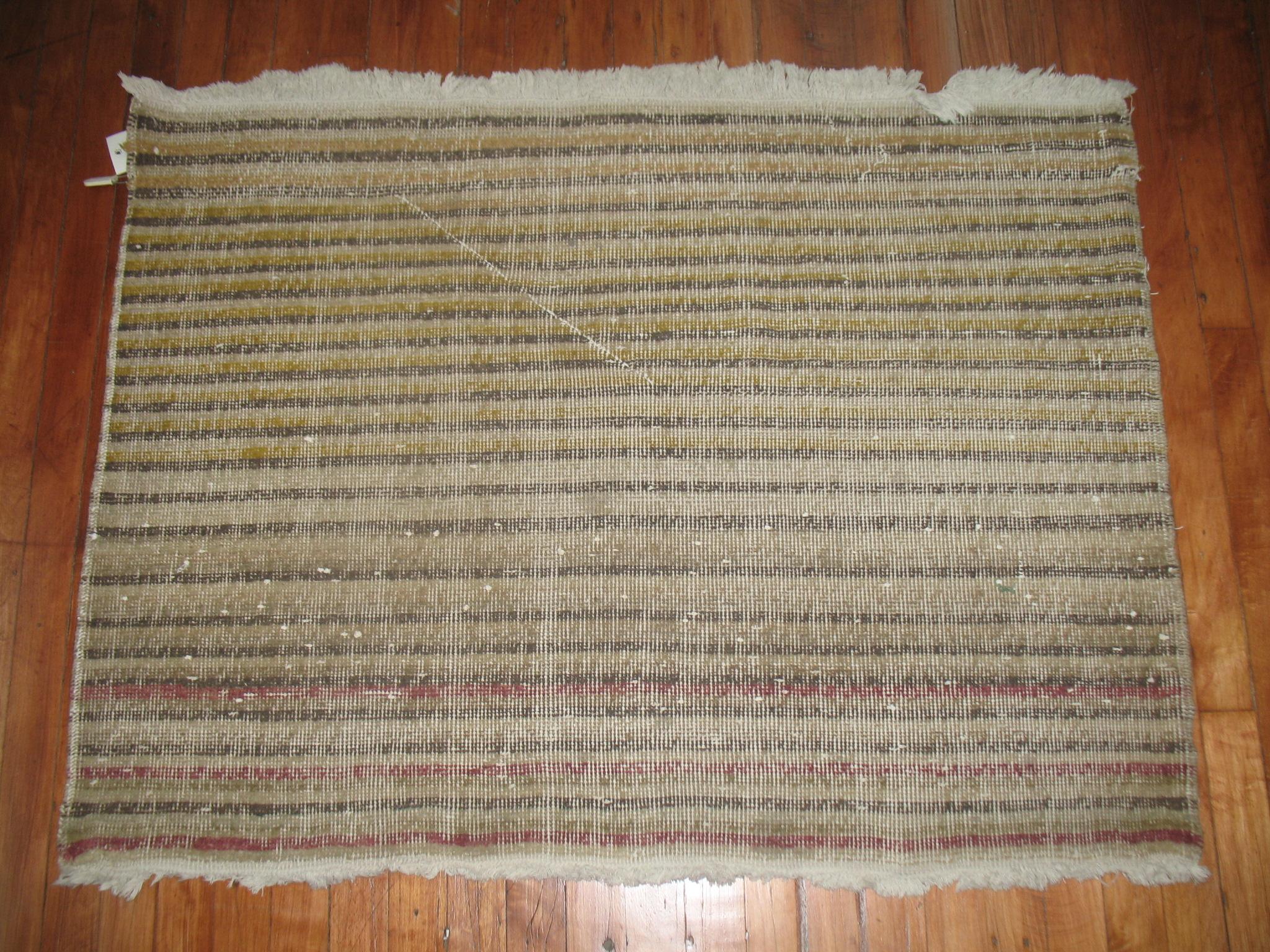 A one-of-a-kind weather-textured Turkish deco rug.

2'10'' x 3'9''