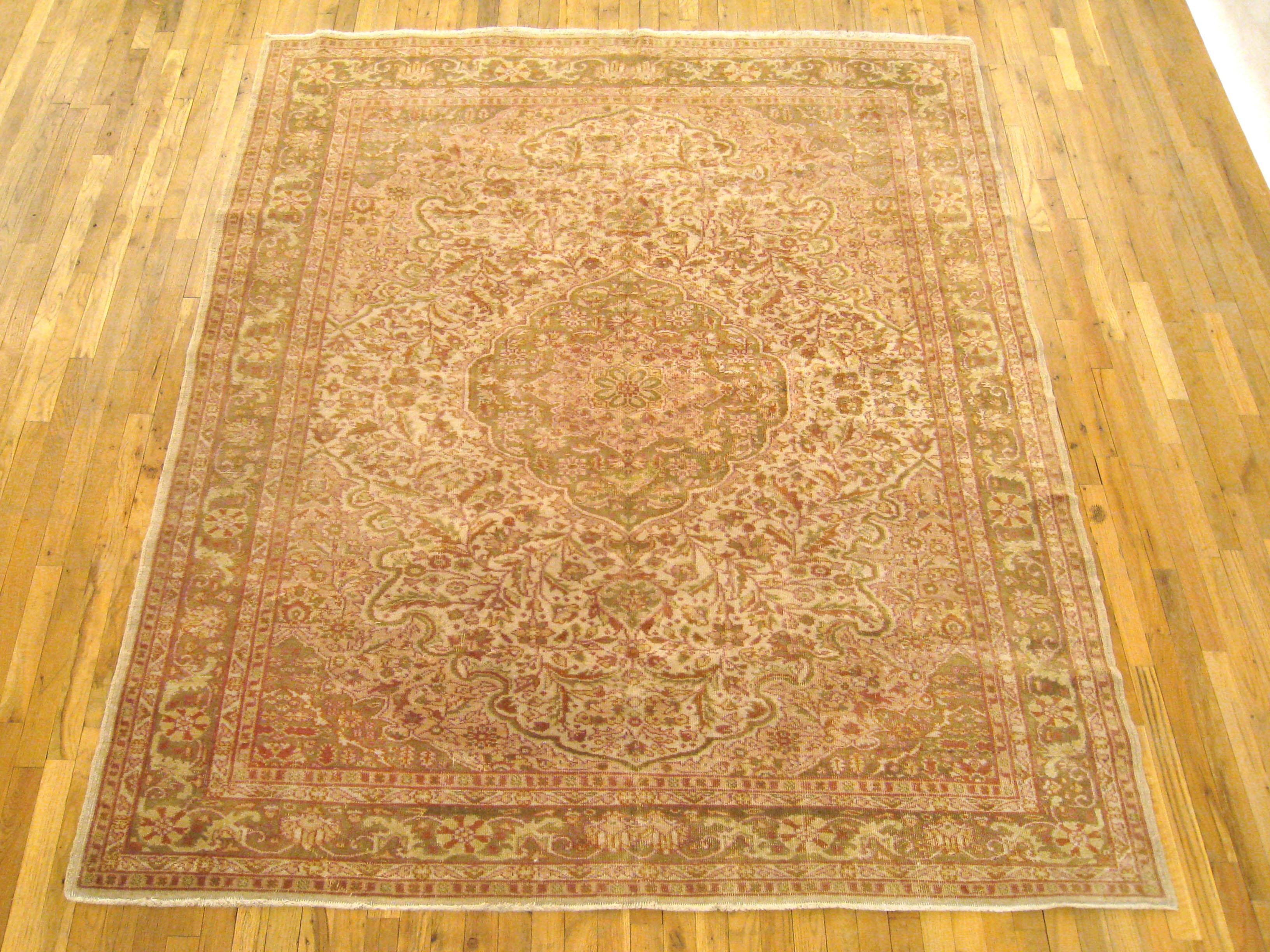 Vintage Turkish Turkish rug, Small size, circa 1900

A one-of-a-kind vintage Turkish Turkish Oriental Carpet, hand-knotted with soft wool pile. This beautiful rug features a central medallion in a covered ivory primary field, with an elegant green