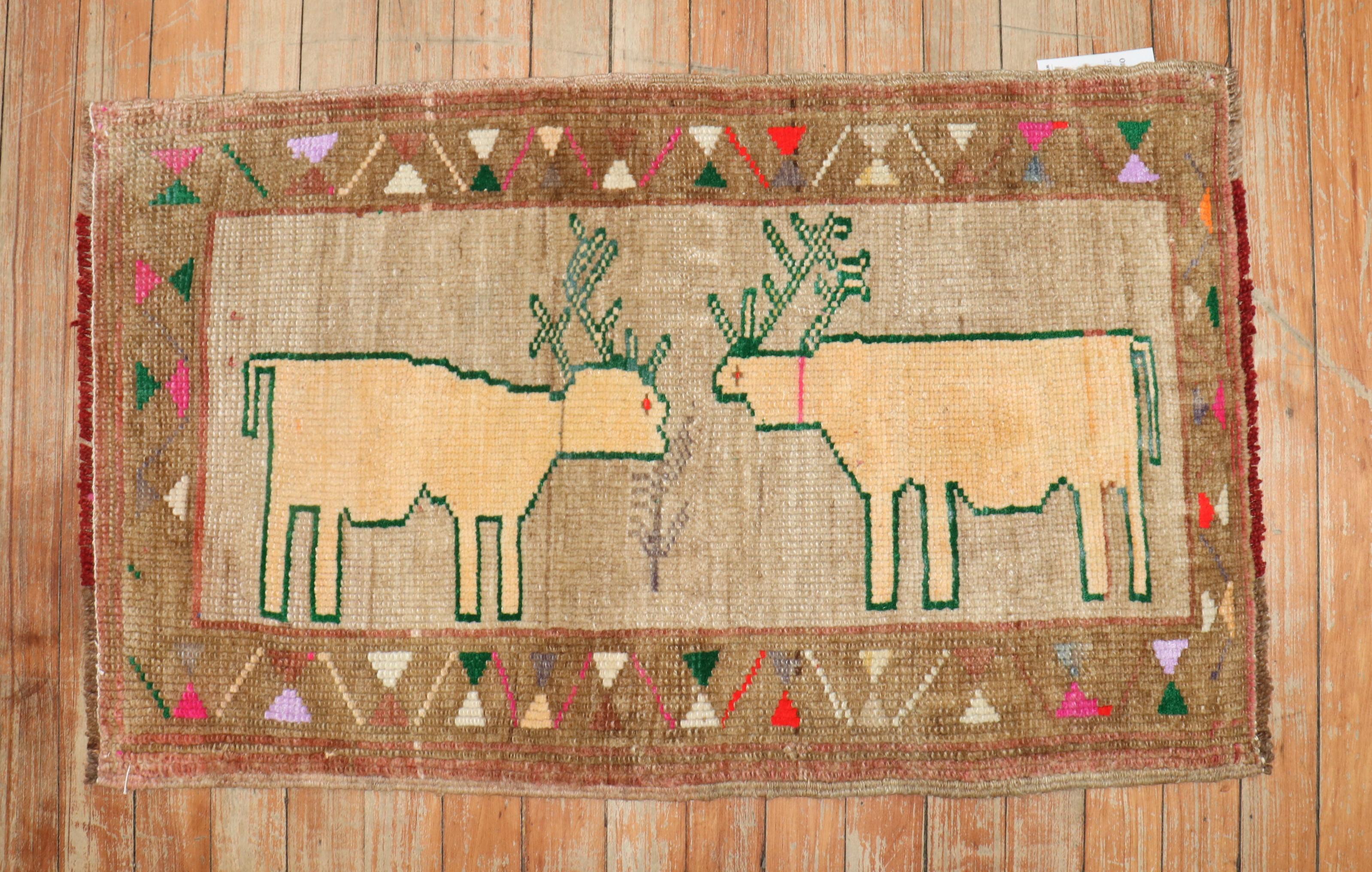 Mid-20th Century Turkish rug depicting 2 deers on a brown field. Check the border out too!

Measures: 1'9'' x 2'9''.