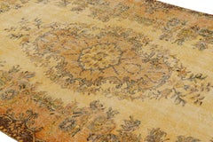 Vintage Turkish Distressed Rug in Gold with Geometric Medallion from Rug & Kilim