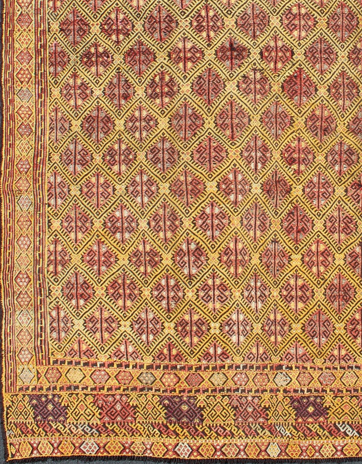              Vintage Turkish Embroidered Kilim Rug with All-Over Diamond Design In Green.
  This colorful vintage, 20th century embroidered Kilim rug features an all-over diamond pattern woven with a well-preserved and vibrant color palette of
