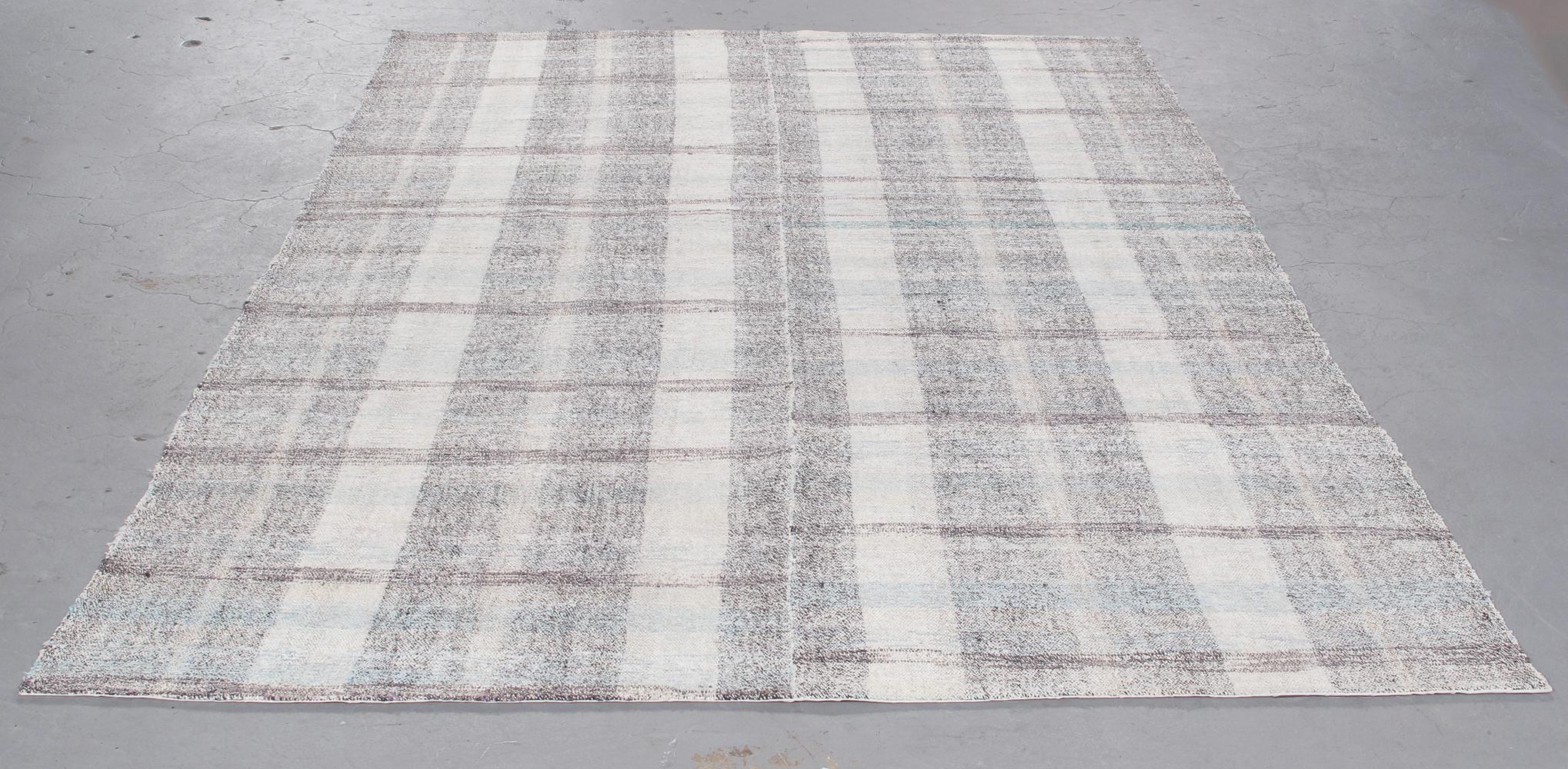 Made in Turkey, this Vintage Turkish Pelas flatweave rug is handmade with hand-spun wool and cotton and features a plaid design. Custom sizes and colors available. Rug size 6'0