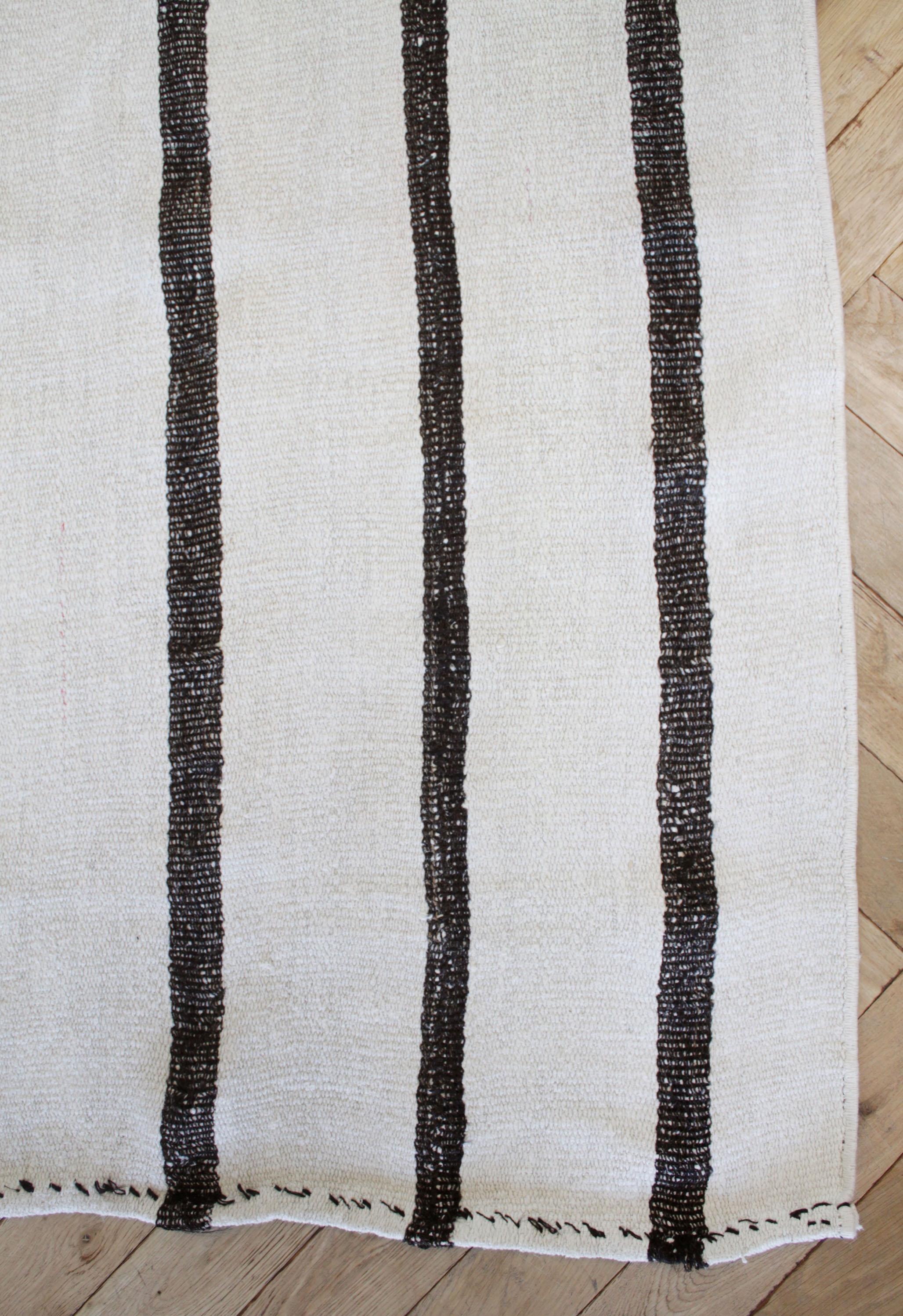 Otto rug
Vintage Turkish rug in brown with white weave and creamy white stripes, with dark brown stripes.
Flat-weave, wool and goat hair, make these extremely durable with great use for high traffic areas. This item has been cleaned, and is ready