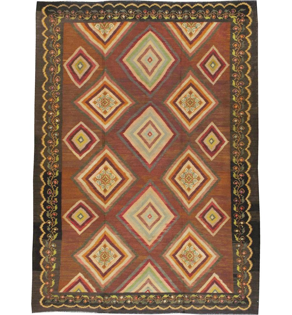 A vintage Turkish flat-woven Kilim carpet from the mid-20th century.