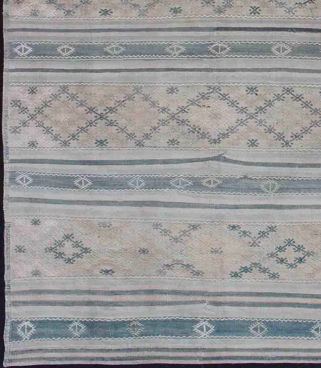 Stripe design Kilim runner with geometric motifs, rug en-176547, country of origin / type: Turkey / Kilim, circa 1950

This flat-woven Kilim runner from Turkey features an exciting composition consisting of stripes rendered in natural tones. The