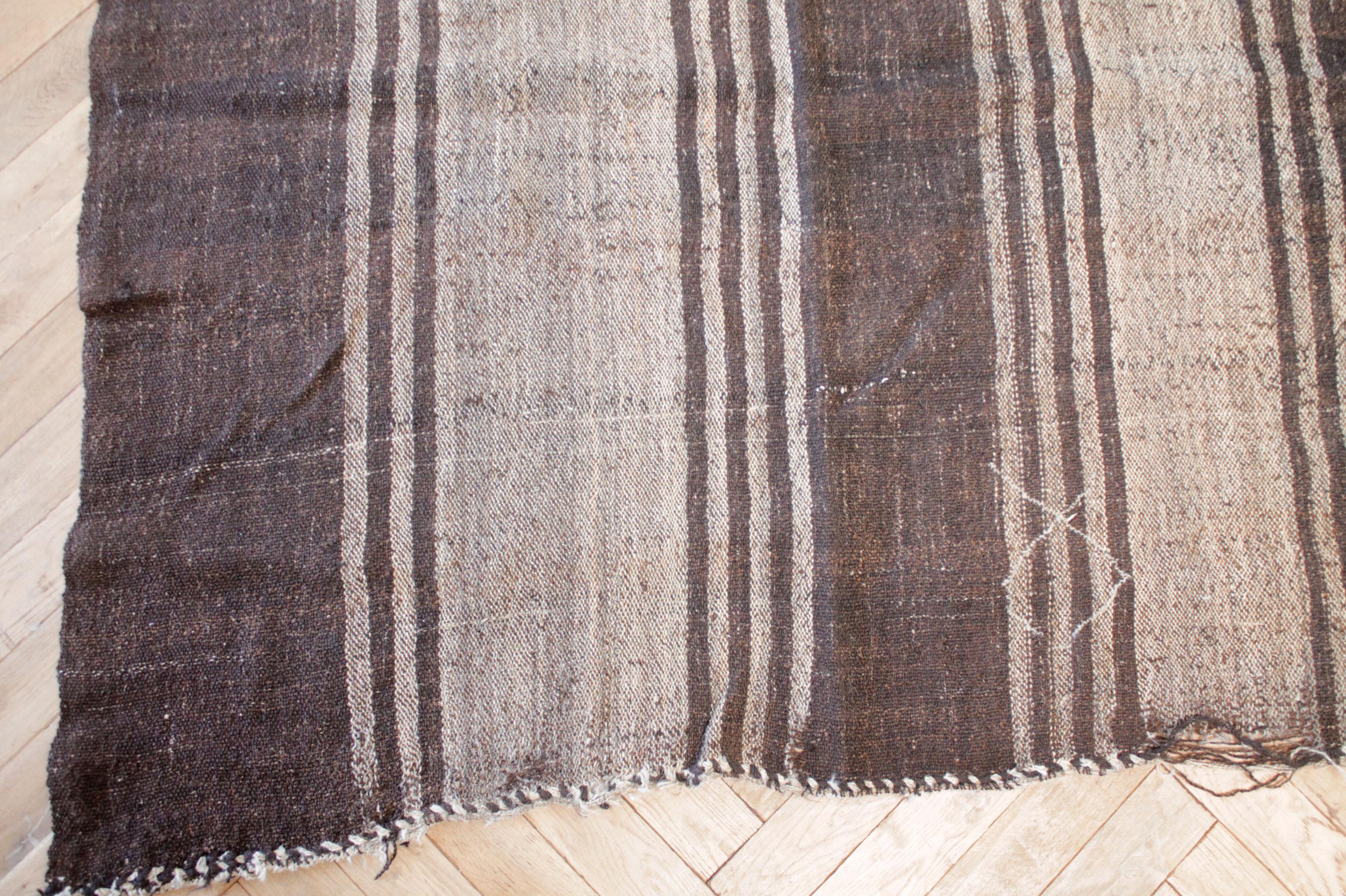 Rodney rug
Vintage Turkish rug in brown with taupe stripes.
Our latest collection has arrived from Turkey, these are great to use as a rug, or let us create a custom ottoman for your out of this piece. If you love this stripe and color combo, let