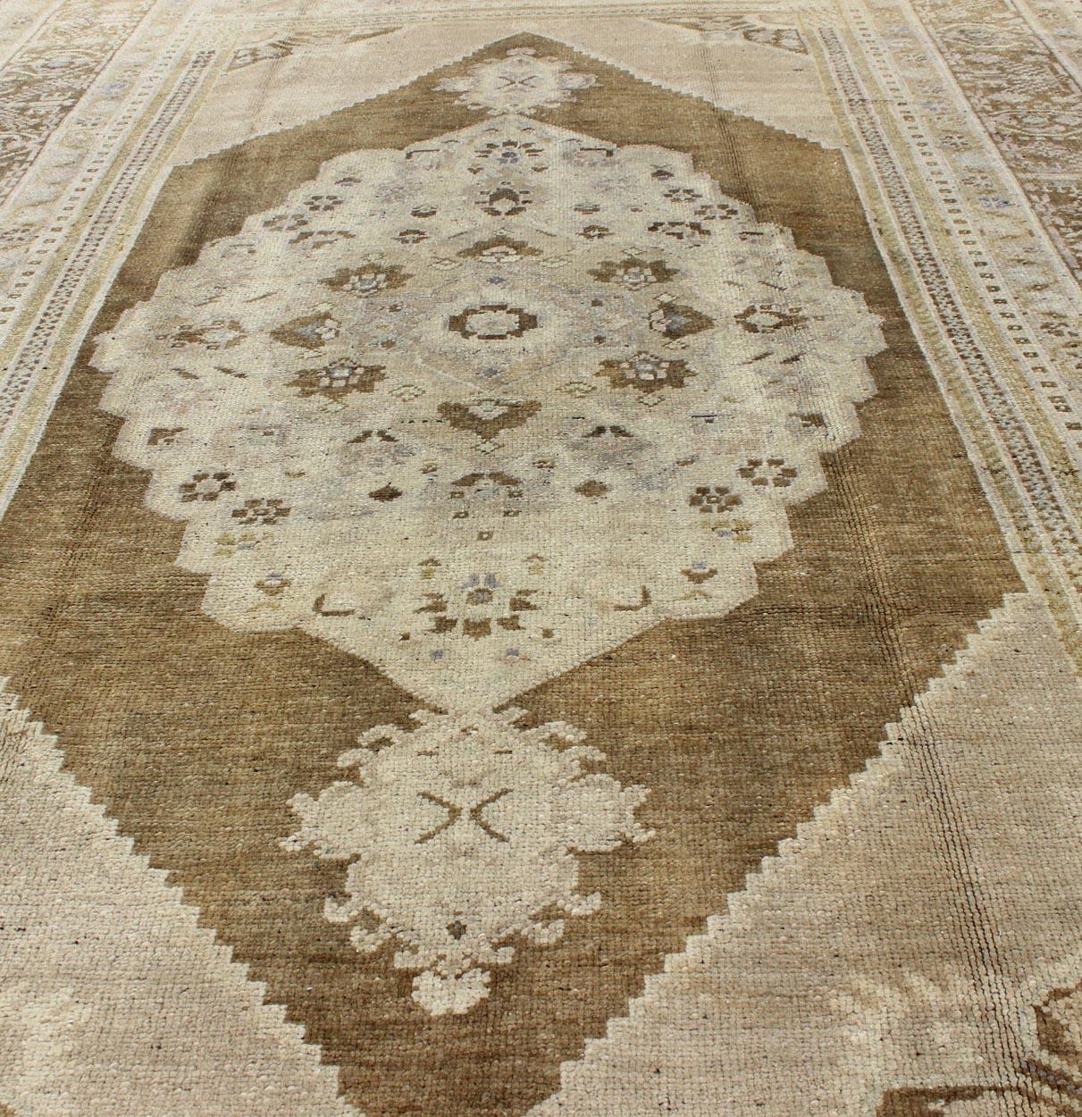 20th Century Vintage Turkish Floral Medallion Oushak Rug in Khaki and Brown Tones For Sale
