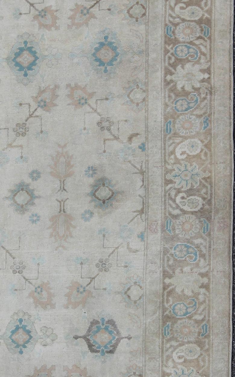 Vintage Turkish Floral Oushak Rug in Pale Gray, Brown and Blue. Country of Origin: Turkey; Type: Oushak; Design: Floral, Oushak Floral; Keivan Woven Arts: rug EN-141684   

Measures: 6'7 x 10'10 

  This vintage Turkish Oushak showcases very classic