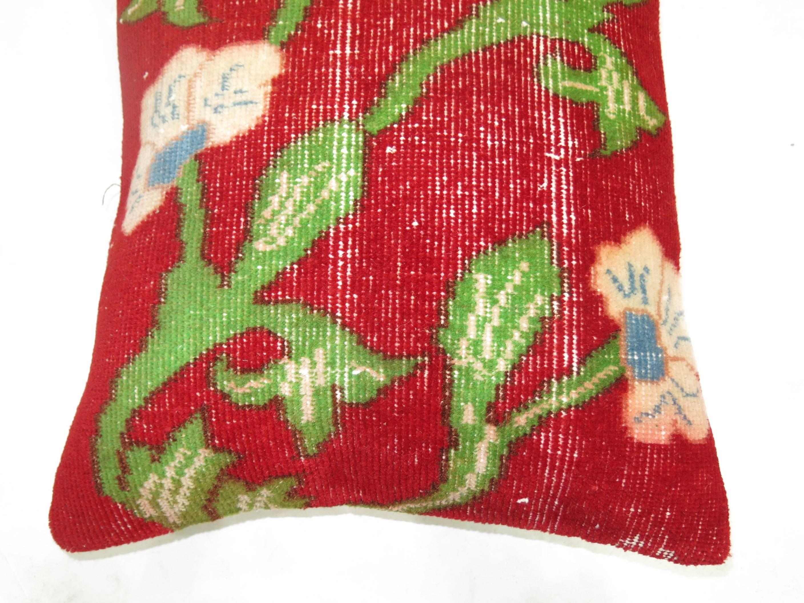 Pillow made from a vintage Turkish floral motif rug.