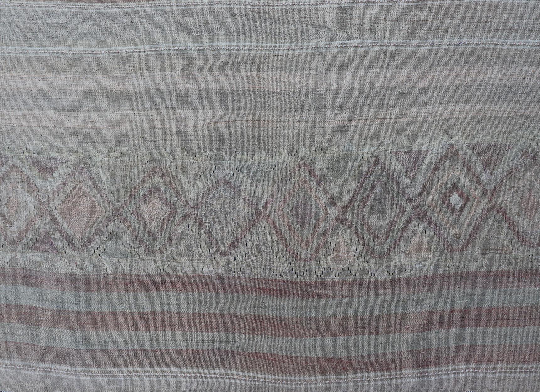 Minimalist design with Faint stripes Turkish Kilim gallery runner in cream, light brown and soft coral color. Keivan Woven Arts / rug EN-141121, country of origin / type: Turkey / Kilim, circa 1950

Measures: 4'7 x 12'7 

This flat-woven Kilim